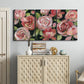 Three-panel canvas wall art featuring bold red floral abstraction, displayed above a cabinet in an entryway.