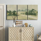 Three-panel canvas wall art featuring pasture landscape in soft watercolor, displayed above a cabinet in an entryway.