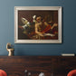 Classical religious painting of Saint Jerome with an angel by Simon Vouet in an ornate champagne frame displayed in a dark-toned interior setting.