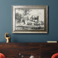 Classical pastoral landscape artwork by Nicolas Berchem in an ornate mottled silver frame displayed in a dark-toned interior setting.