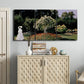 Three-panel canvas wall art featuring woman seated in garden landscape, displayed above a cabinet in an entryway.