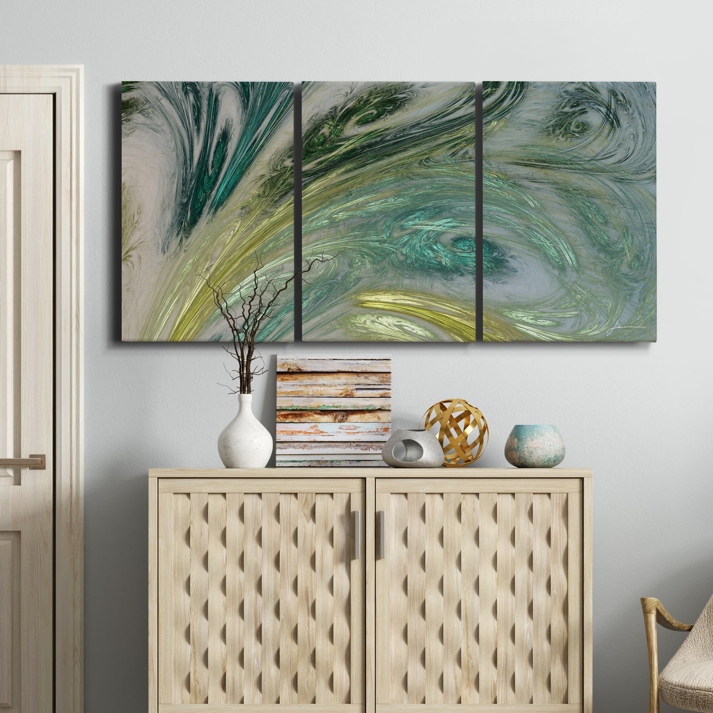 Three-panel canvas wall art featuring layered modern abstract landscape, displayed above a cabinet in an entryway.