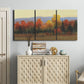 Three-panel canvas wall art featuring autumn landscape changing foliage, displayed above a cabinet in an entryway.