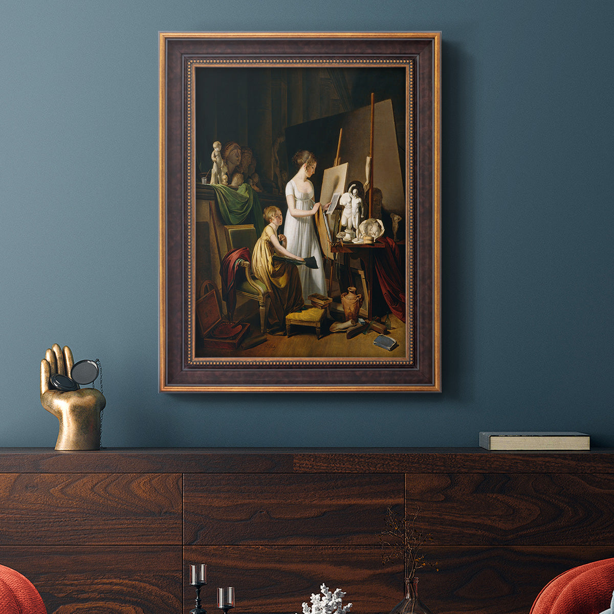 Classical interior painting of an artist at work by Louis-Leopold Boilly in an ornate bronzed mahogany wood frame displayed in a dark-toned interior setting.