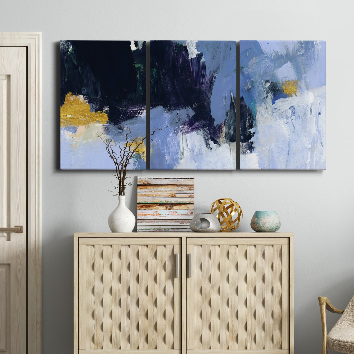 Three-panel canvas wall art featuring icy abstract arctic ledge, displayed above a cabinet in an entryway.