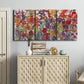 Three-panel canvas wall art featuring colorful floral arrangement, displayed above a cabinet in an entryway.
