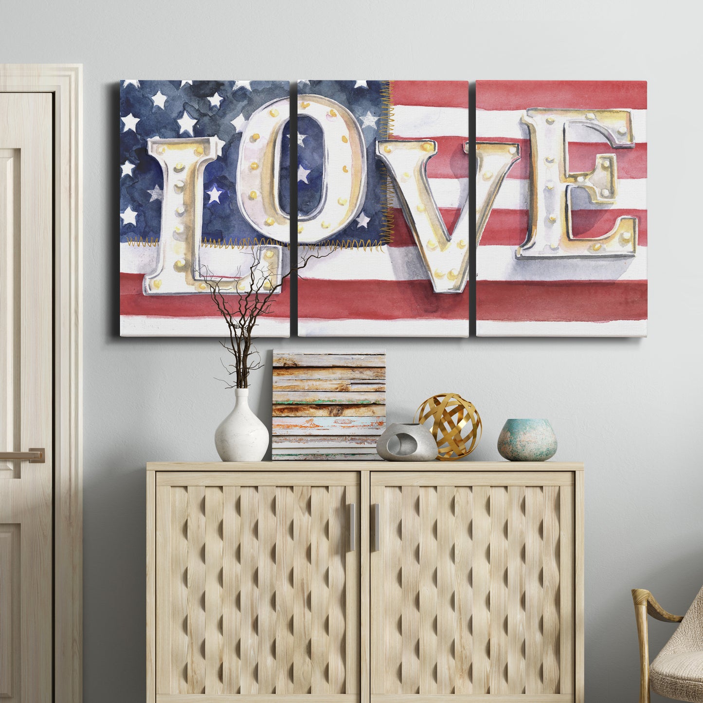 Three-panel canvas wall art featuring patriotic rustic typography art, displayed above a cabinet in an entryway.
