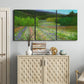 Three-panel canvas wall art featuring fresh spring meadow landscape, displayed above a cabinet in an entryway.