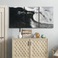 Three-panel canvas wall art featuring black and white crashing ocean waves, displayed above a cabinet in an entryway.