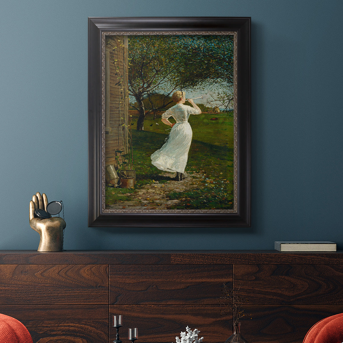 Narrative religious genre scene by Winslow Homer in an ornate black frame with gilded inner detail displayed in a dark-toned interior setting.
