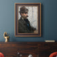 Impressionist portrait of a seated man by Édouard Manet in an ornate bronzed mahogany wood frame displayed in a dark-toned interior setting.