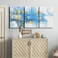 Three-panel canvas wall art featuring blue toned abstract city rhythm, displayed above a cabinet in an entryway.
