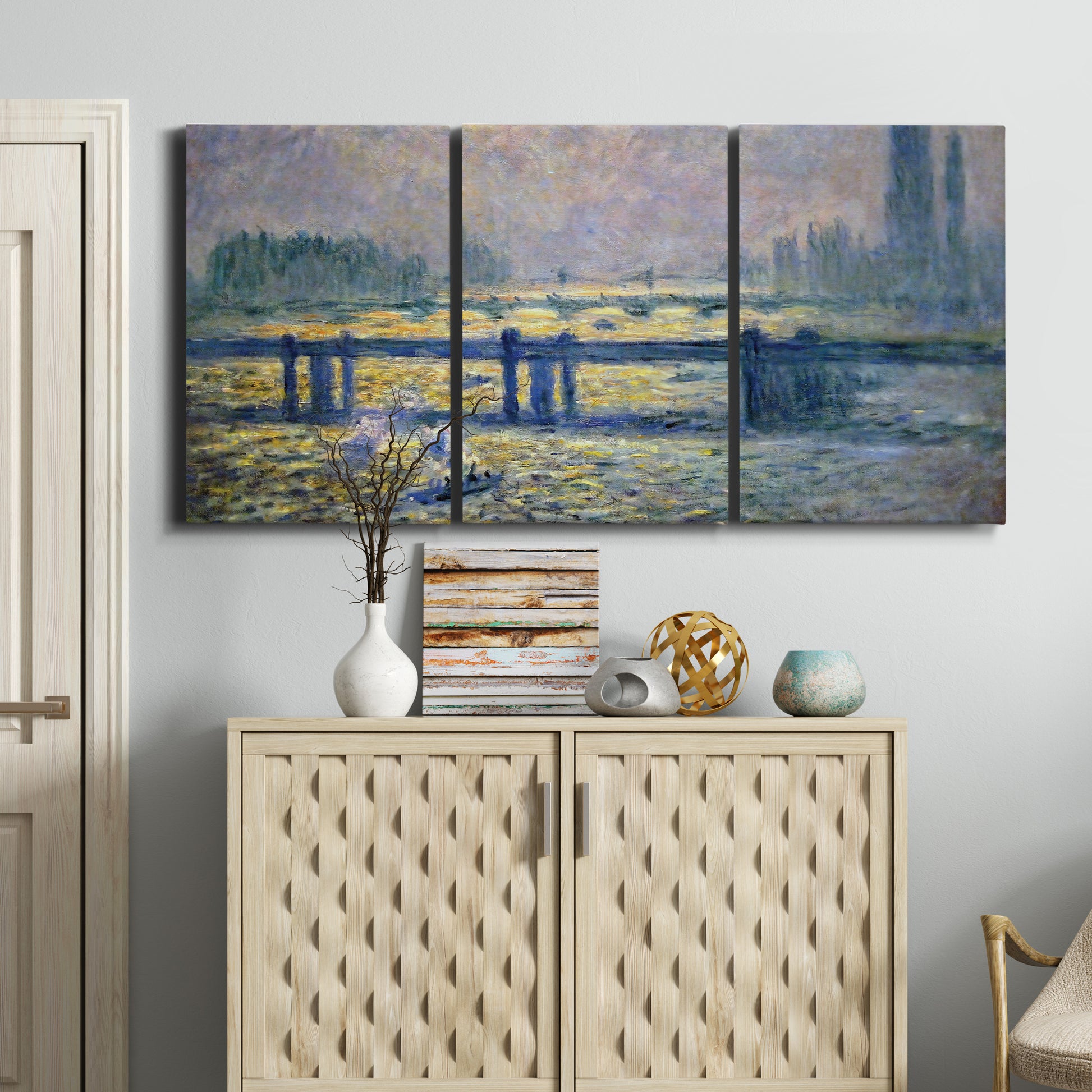 Three-panel canvas wall art featuring london bridge crossing wide river, displayed above a cabinet in an entryway.