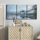 Three-panel canvas wall art featuring calm waters at sunrise photograph, displayed above a cabinet in an entryway.