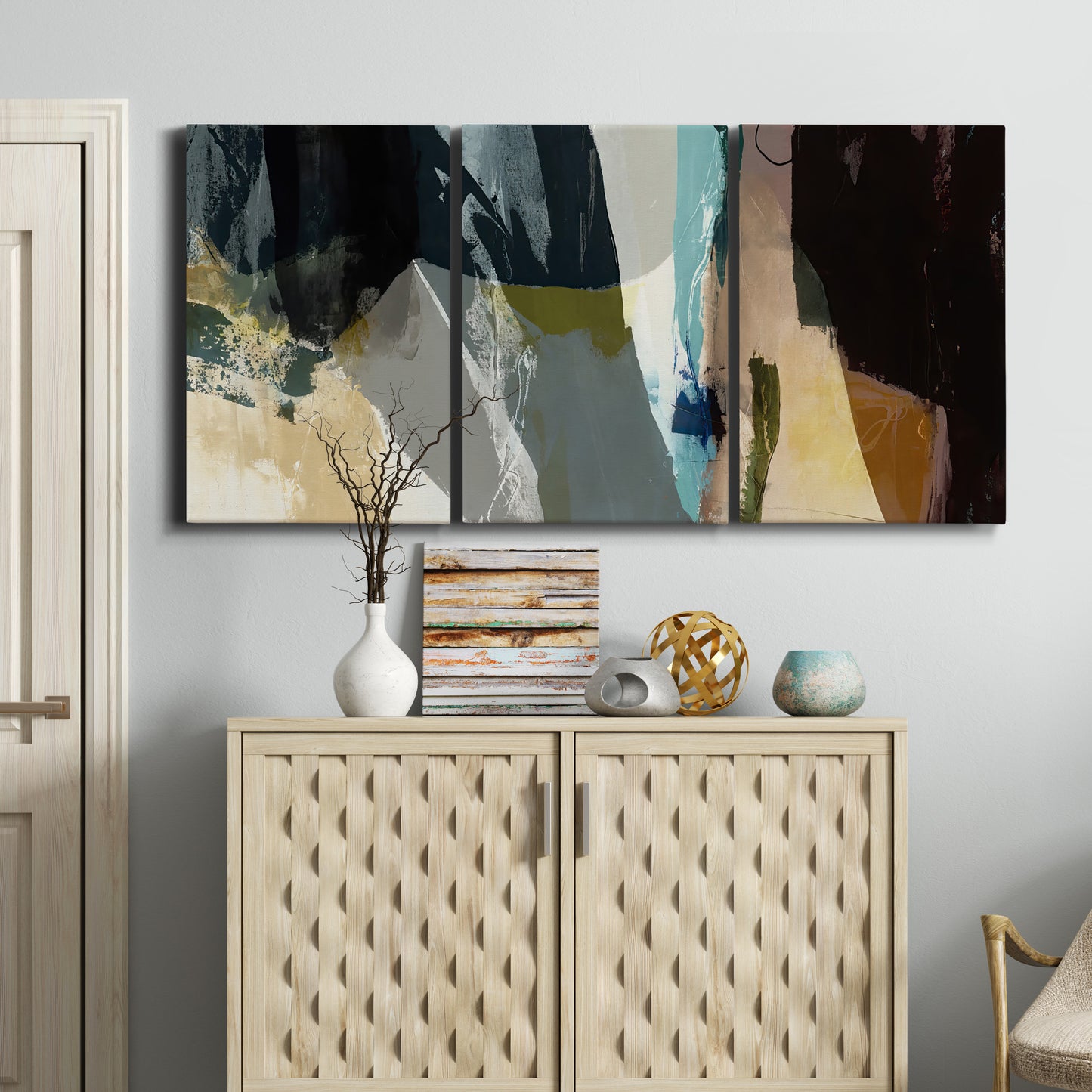 Three-panel canvas wall art featuring layered neutral abstract textures, displayed above a cabinet in an entryway.