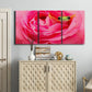 Three-panel canvas wall art featuring animal photography with floral elements, displayed above a cabinet in an entryway.