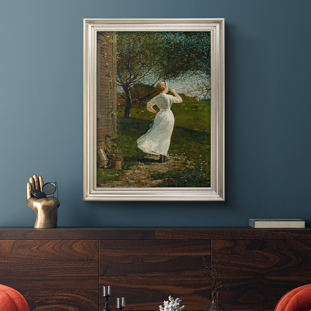 Narrative religious genre scene by Winslow Homer in an ornate champagne frame displayed in a dark-toned interior setting.