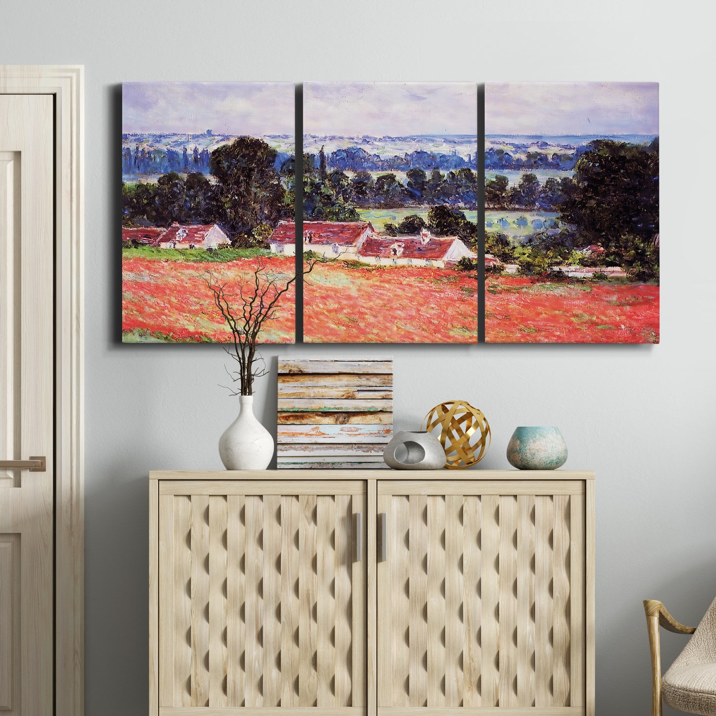 Three-panel canvas wall art featuring poppy field at giverny in bloom, displayed above a cabinet in an entryway.