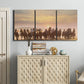 Three-panel canvas wall art featuring running horses captured in motion, displayed above a cabinet in an entryway.
