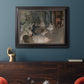 Impressionist backstage ballet scene by Edgar Degas in an ornate black frame with gilded inner detail displayed in a dark-toned interior setting.