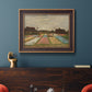 Impressionist Dutch bulb field landscape by Vincent van Gogh in an ornate bronzed mahogany wood frame displayed in a dark-toned interior setting.