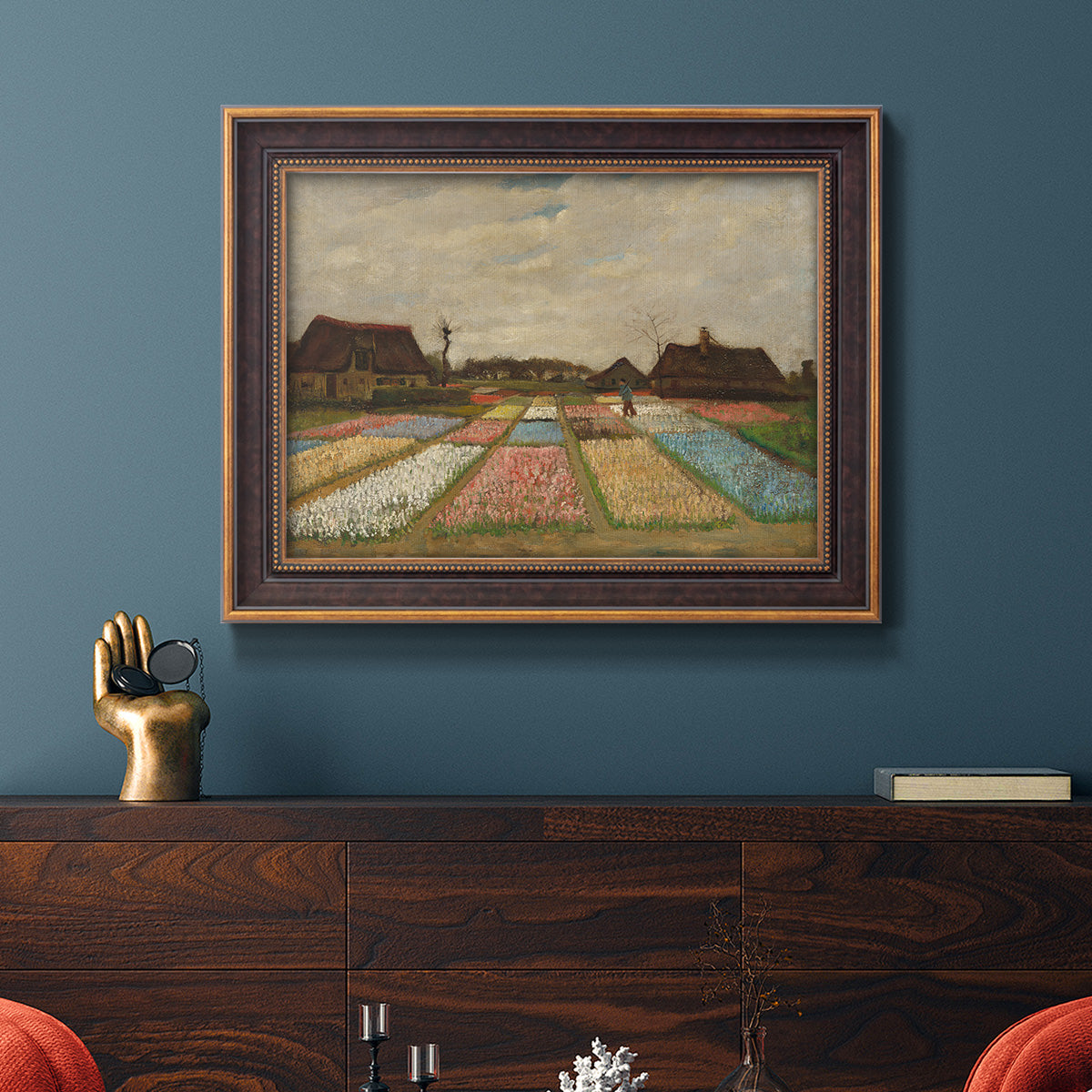 Impressionist Dutch bulb field landscape by Vincent van Gogh in an ornate bronzed mahogany wood frame displayed in a dark-toned interior setting.