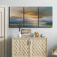 Three-panel canvas wall art featuring tranquil beach at sunset, displayed above a cabinet in an entryway.