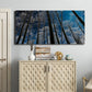 Three-panel canvas wall art featuring night landscape silhouette photography, displayed above a cabinet in an entryway.