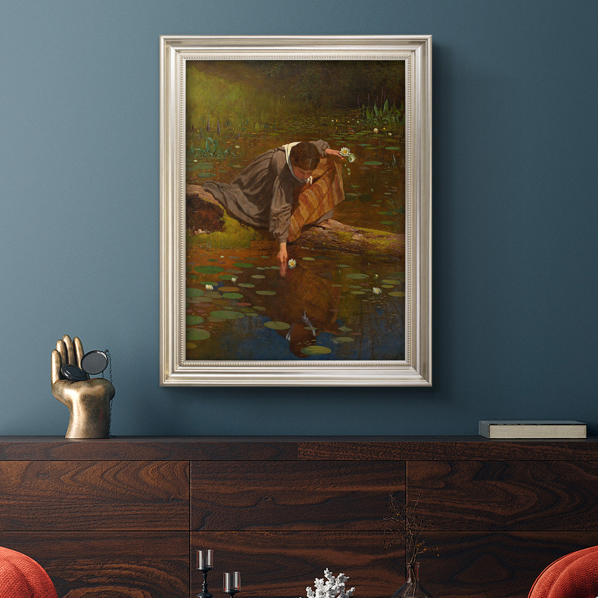 Realist genre painting of figures gathering lilies by Eastman Johnson in an ornate champagne frame displayed in a dark-toned interior setting.