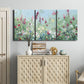 Three-panel canvas wall art featuring night landscape silhouette photography, displayed above a cabinet in an entryway.