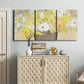 Three-panel canvas wall art featuring abstract floral table arrangement, displayed above a cabinet in an entryway.