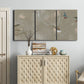 Three-panel canvas wall art featuring mid century terrazzo inspired abstraction, displayed above a cabinet in an entryway.
