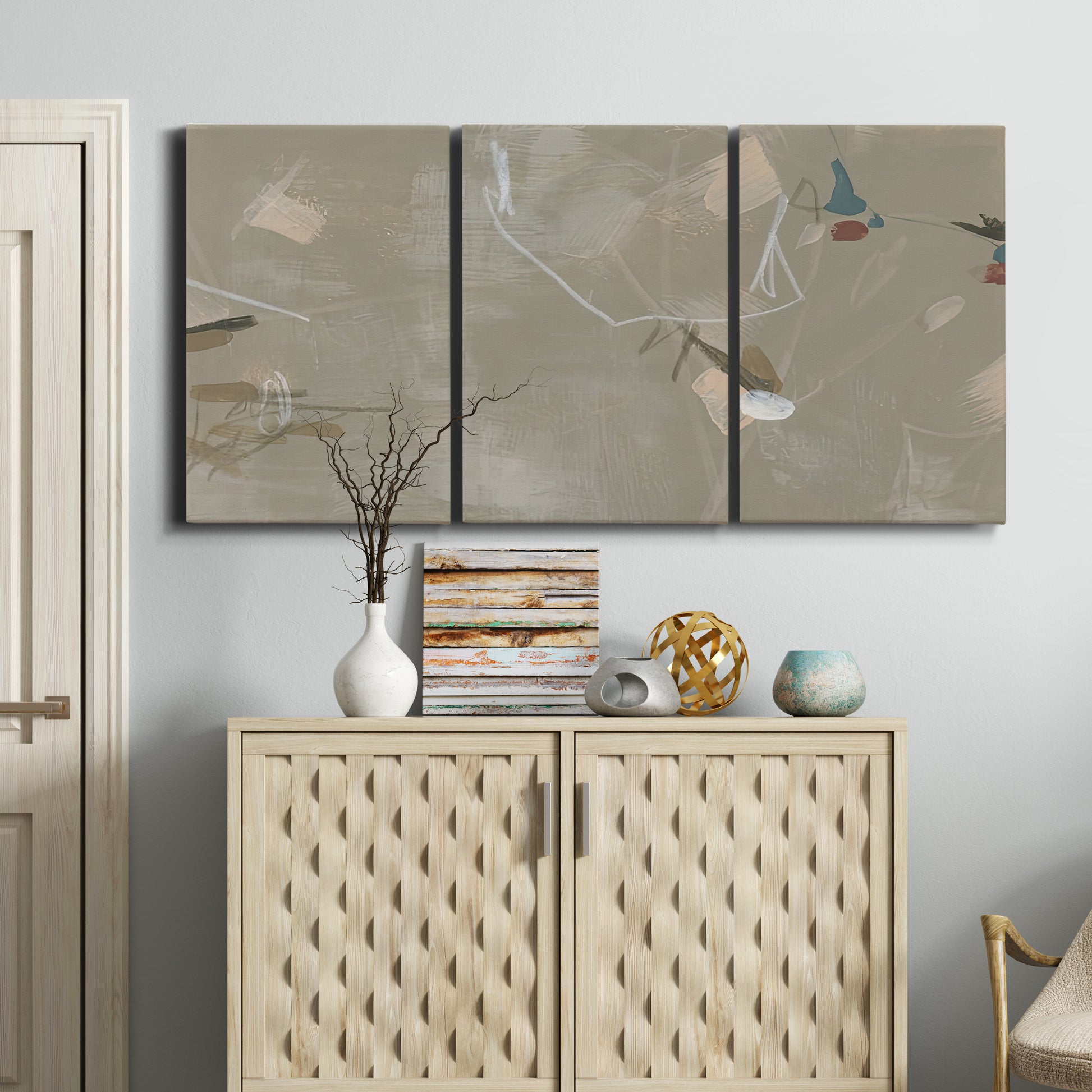 Three-panel canvas wall art featuring mid century terrazzo inspired abstraction, displayed above a cabinet in an entryway.
