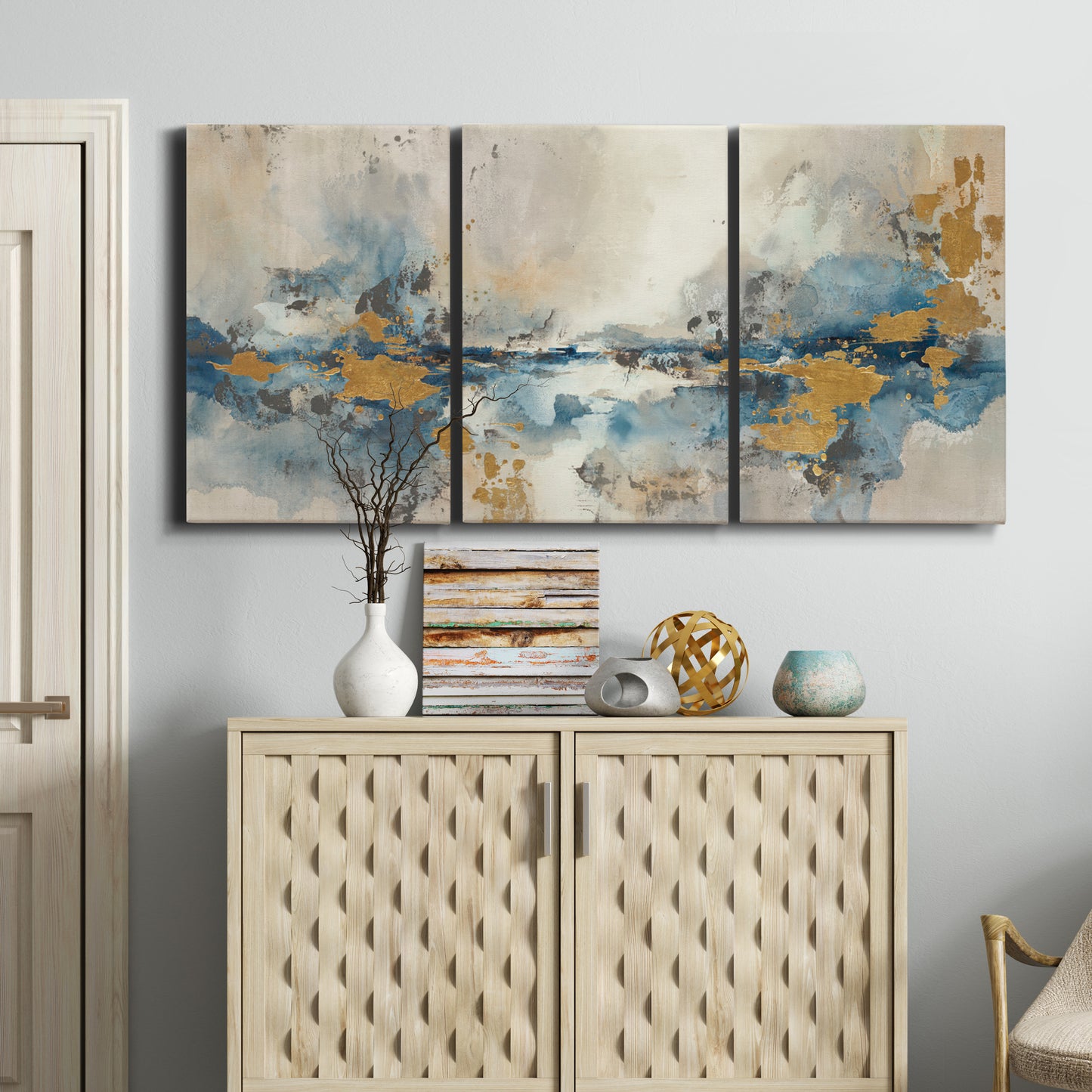 Three-panel canvas wall art featuring abstract soft morning light, displayed above a cabinet in an entryway.