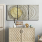 Three-panel canvas wall art featuring circular abstract energy forms, displayed above a cabinet in an entryway.