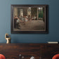 Early impressionist ballet rehearsal painting by Edgar Degas in an ornate black frame with gilded inner detail displayed in a dark-toned interior setting.