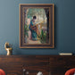 Impressionist portrait of Madame Monet sewing by Claude Monet in an ornate bronzed mahogany wood frame displayed in a dark-toned interior setting.