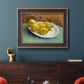 Impressionist still life with lemons by Vincent van Gogh in an ornate bronzed mahogany wood frame displayed in a dark-toned interior setting.