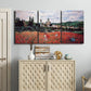 Three-panel canvas wall art featuring poppy field beside village landscape, displayed above a cabinet in an entryway.