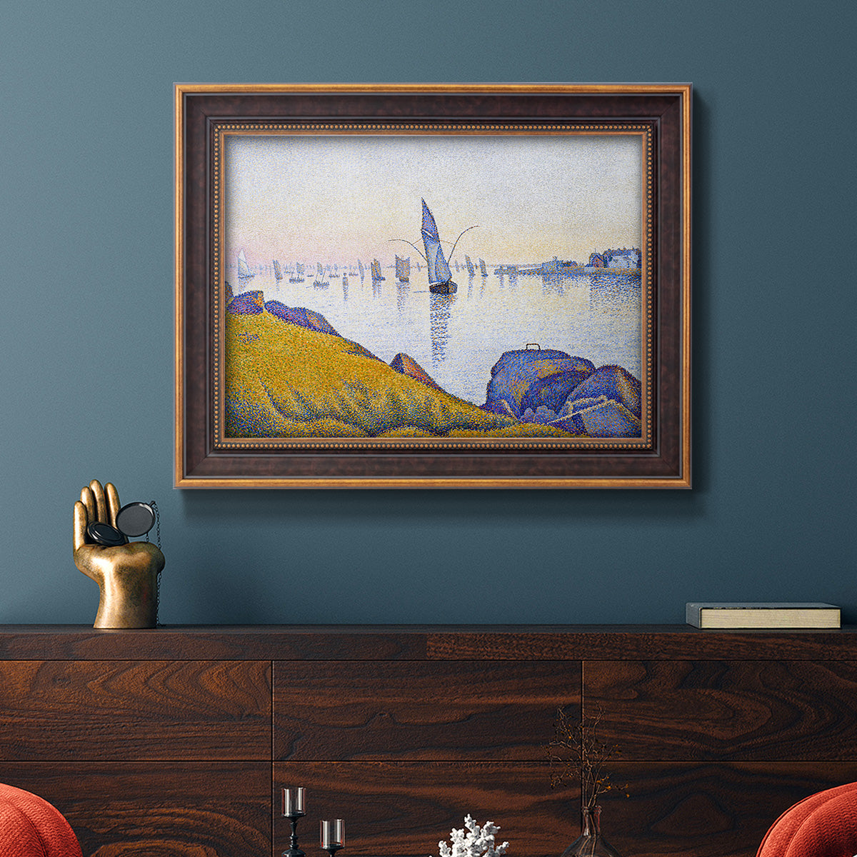 Impressionist coastal harbor at dusk by Paul Signac in an ornate bronzed mahogany wood frame displayed in a dark-toned interior setting.