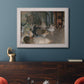 Impressionist backstage ballet scene by Edgar Degas in an ornate weathered white frame displayed in a dark-toned interior setting.
