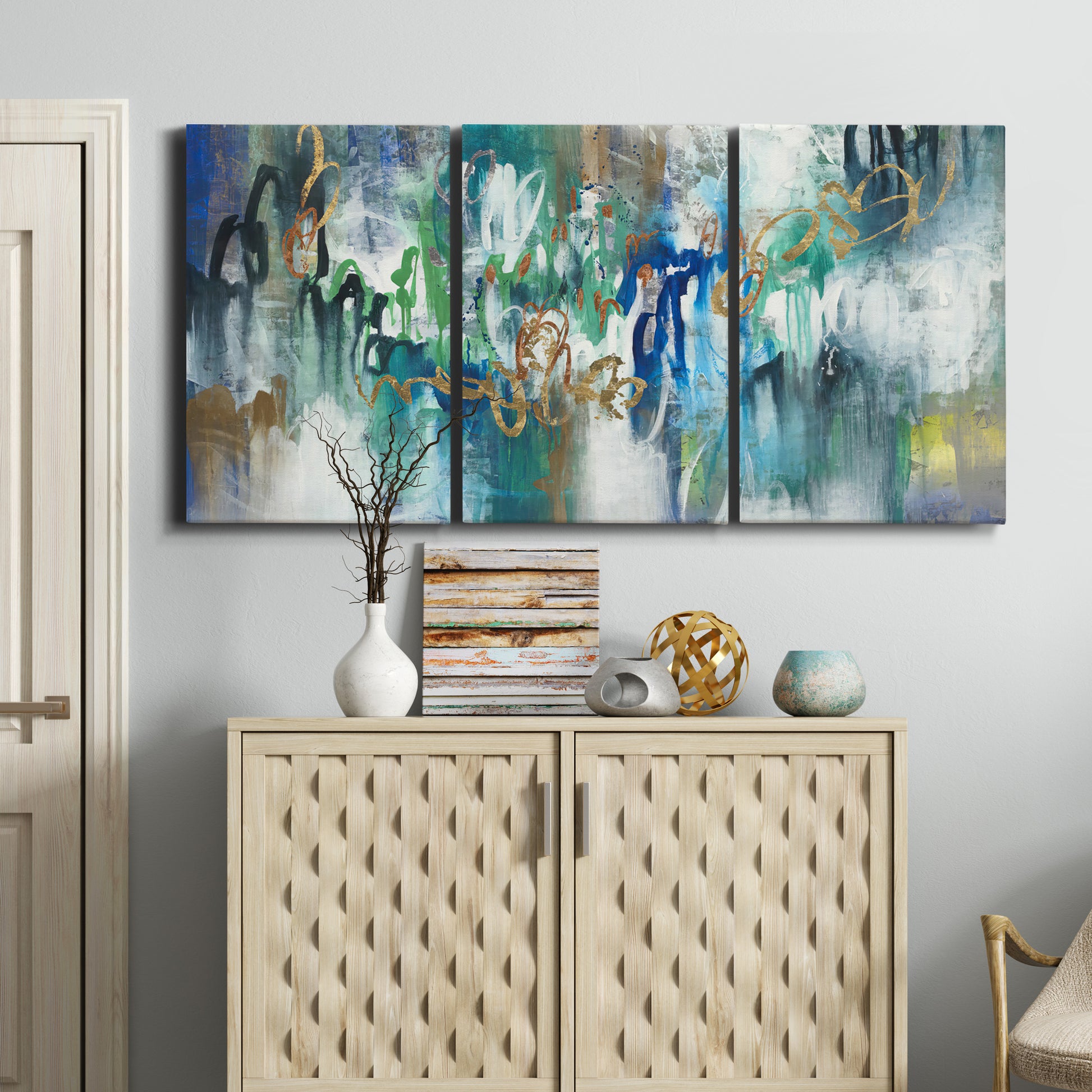 Three-panel canvas wall art featuring joyful abstract color harmony, displayed above a cabinet in an entryway.