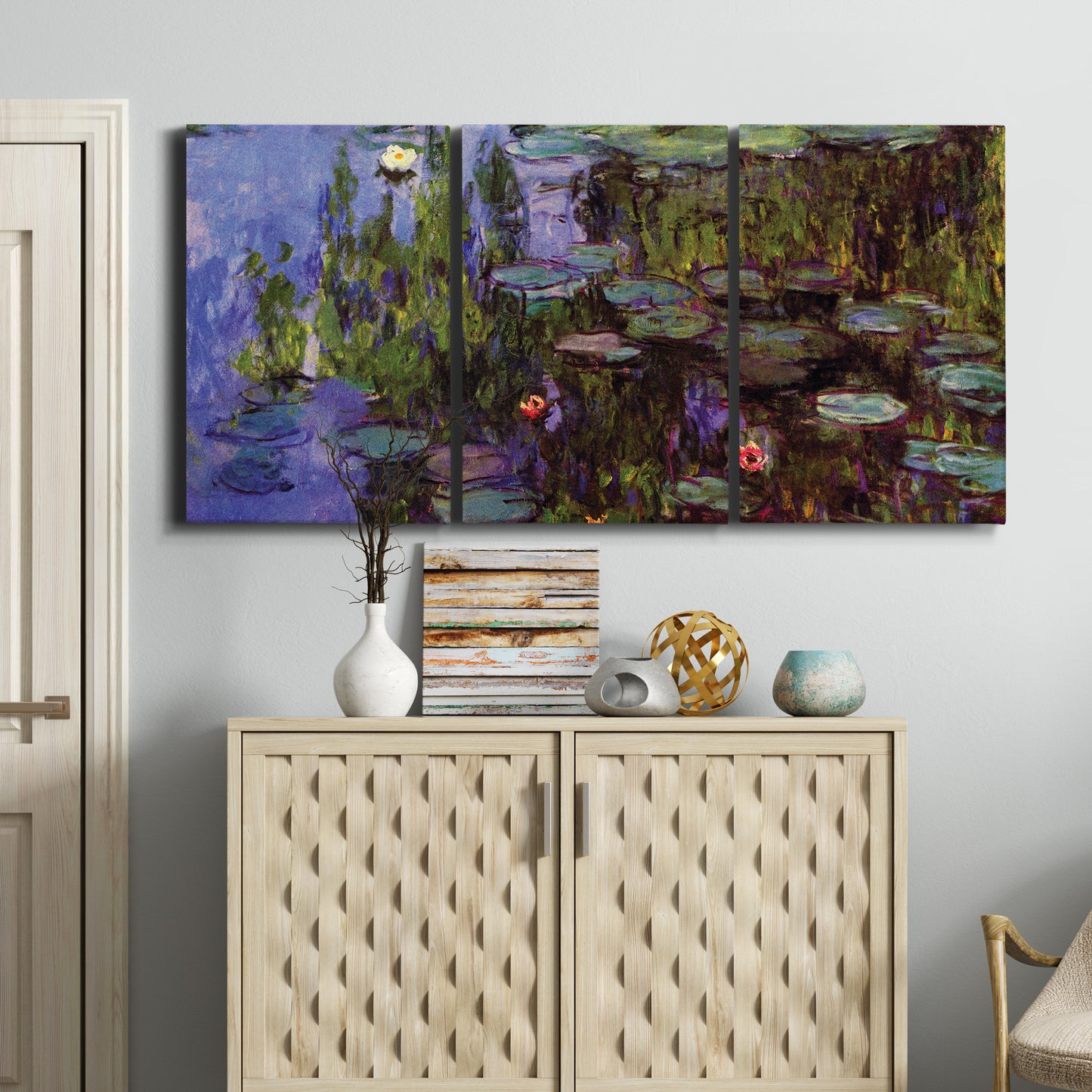 Three-panel canvas wall art featuring water lilies on calm pond, displayed above a cabinet in an entryway.