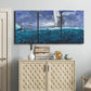 Three-panel canvas wall art featuring sailboats moving across water, displayed above a cabinet in an entryway.