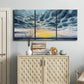 Three-panel canvas wall art featuring tropical coastal sunset over water, displayed above a cabinet in an entryway.
