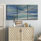 Three-panel canvas wall art featuring sunbeams breaking through coastal clouds, displayed above a cabinet in an entryway.
