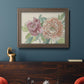 Modern peony floral drawing in an ornate traditional bronze frame displayed in a dark-toned interior setting.