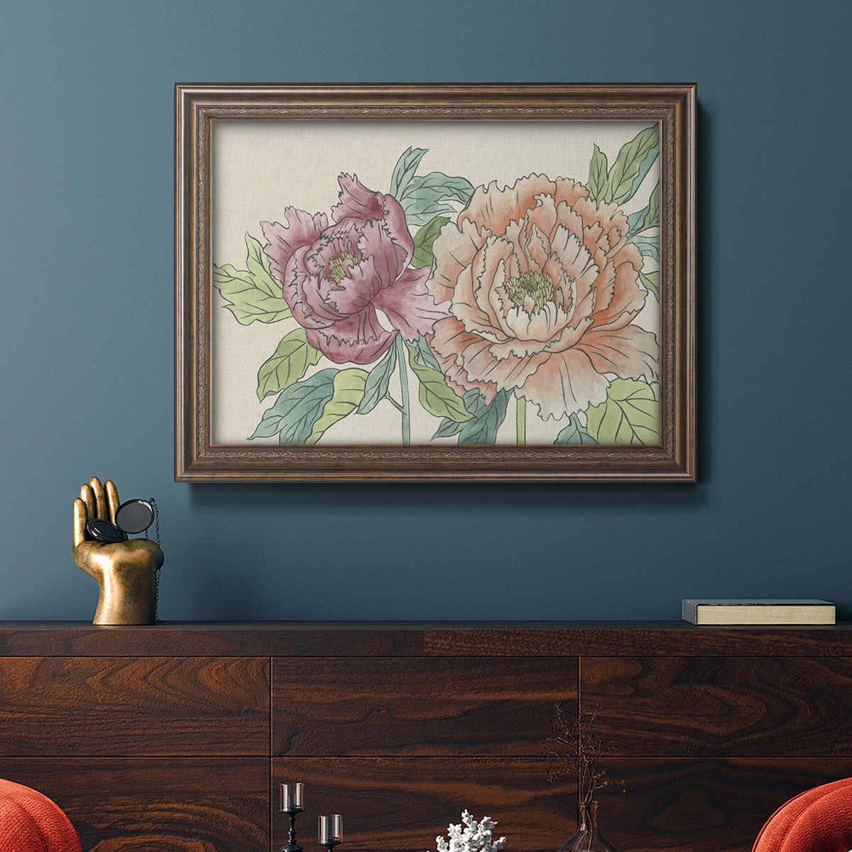Modern peony floral drawing in an ornate traditional bronze frame displayed in a dark-toned interior setting.