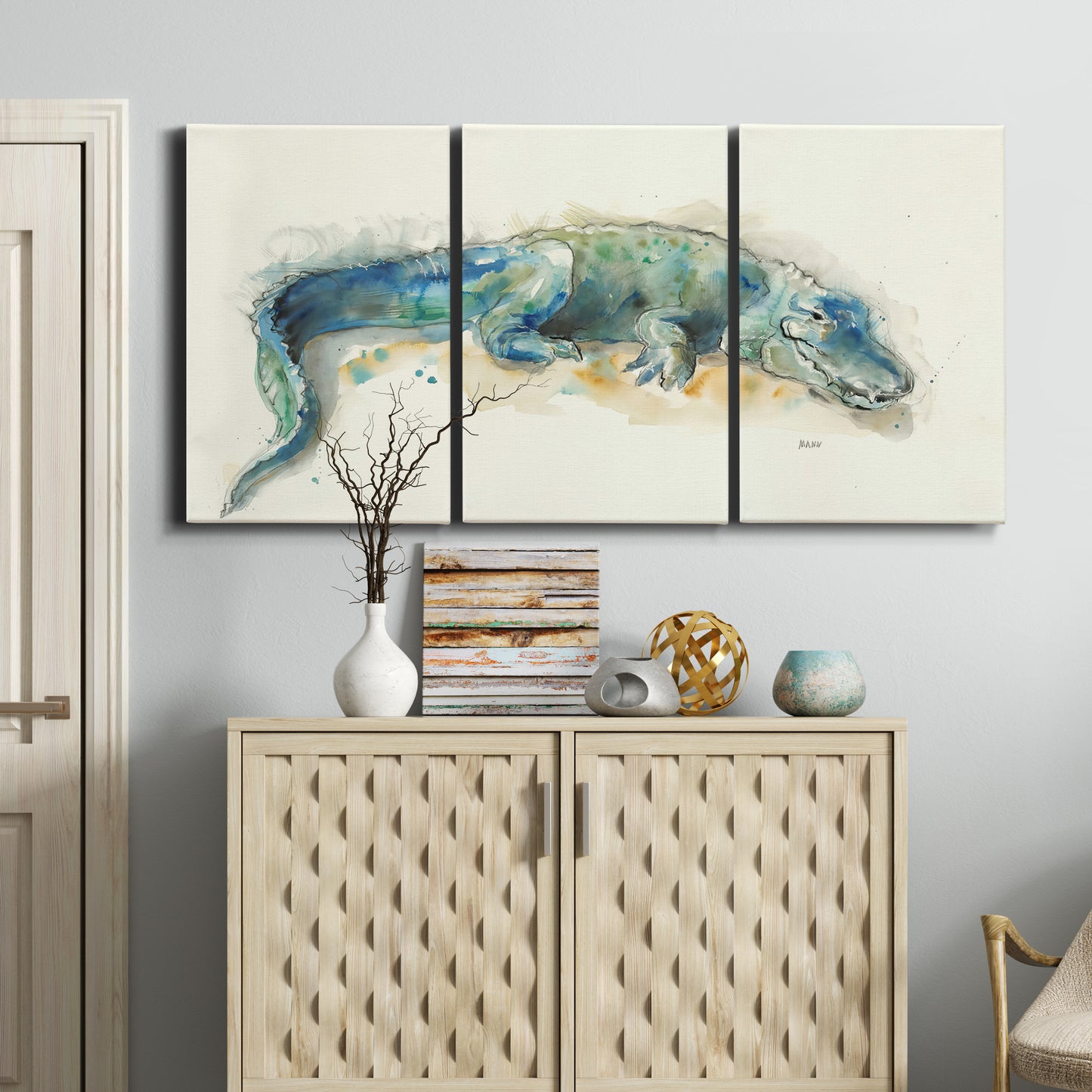 Three-panel canvas wall art featuring alligator illustrated wildlife portrait, displayed above a cabinet in an entryway.