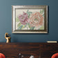 Modern peony floral drawing in an ornate mottled silver frame displayed in a dark-toned interior setting.